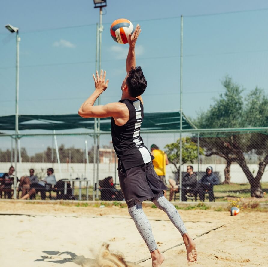Volleyball player jumping to spike